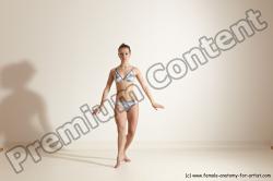 Swimsuit Gymnastic poses Woman White Moving poses Slim long brown Dynamic poses Academic